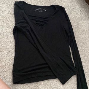 Black, stretch long sleeve with crisscrossed v-neckline.